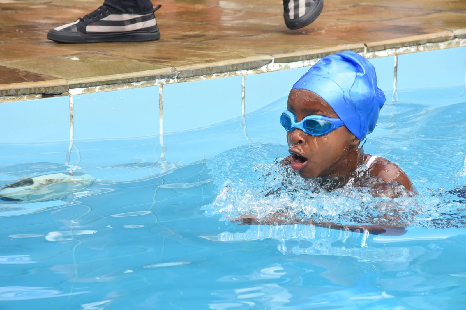 A St. Christopher’s swimmer at the pool wall during the gala