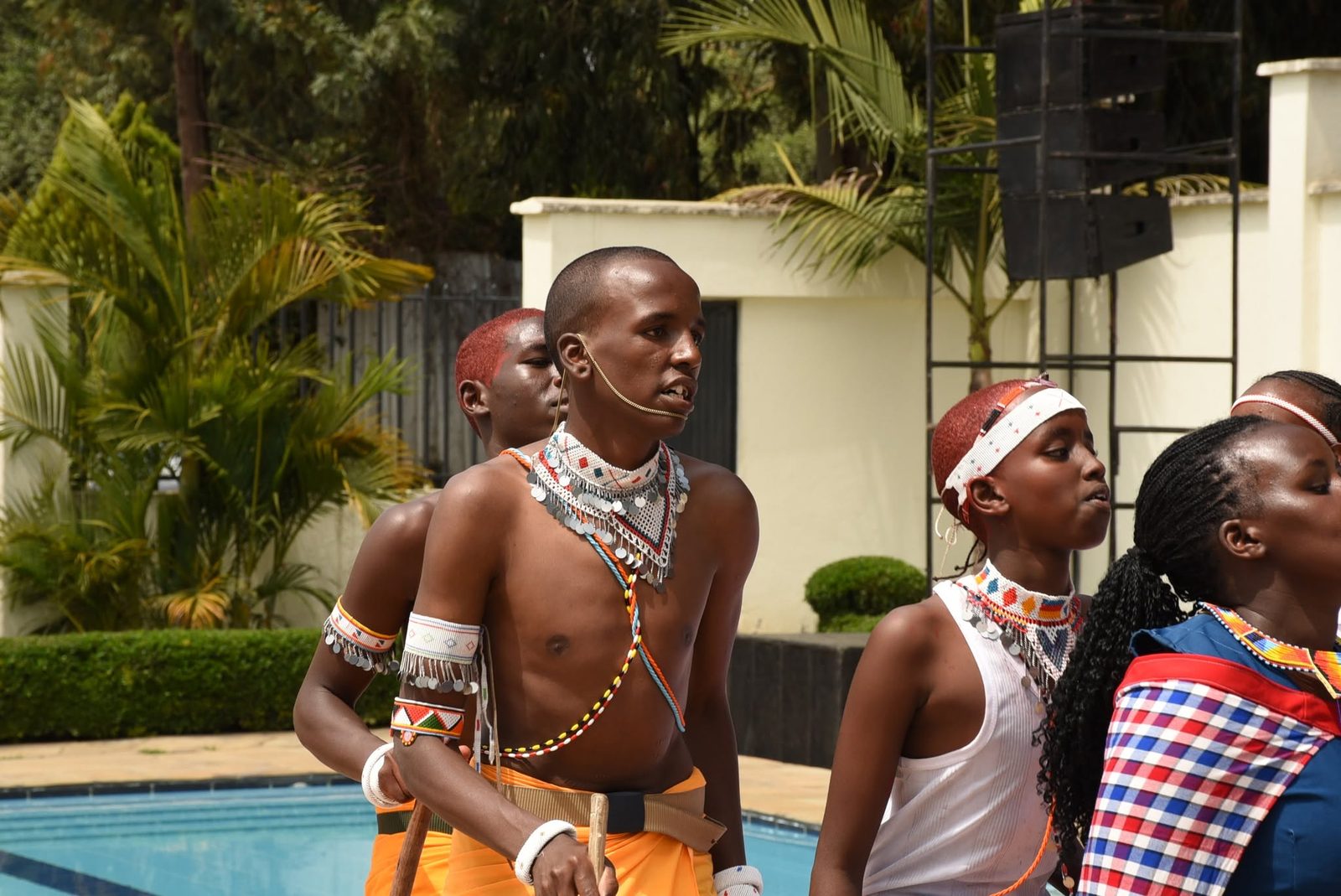 A student in beaded Maasai regalia during the cultural dance performance