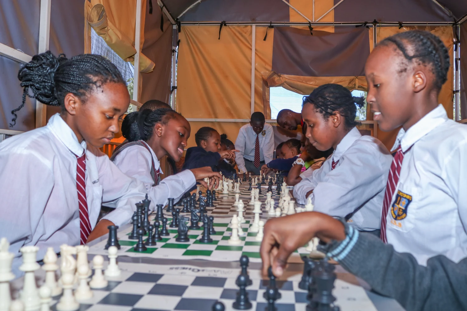 Rows of St. Christopher's students playing chess along a long table