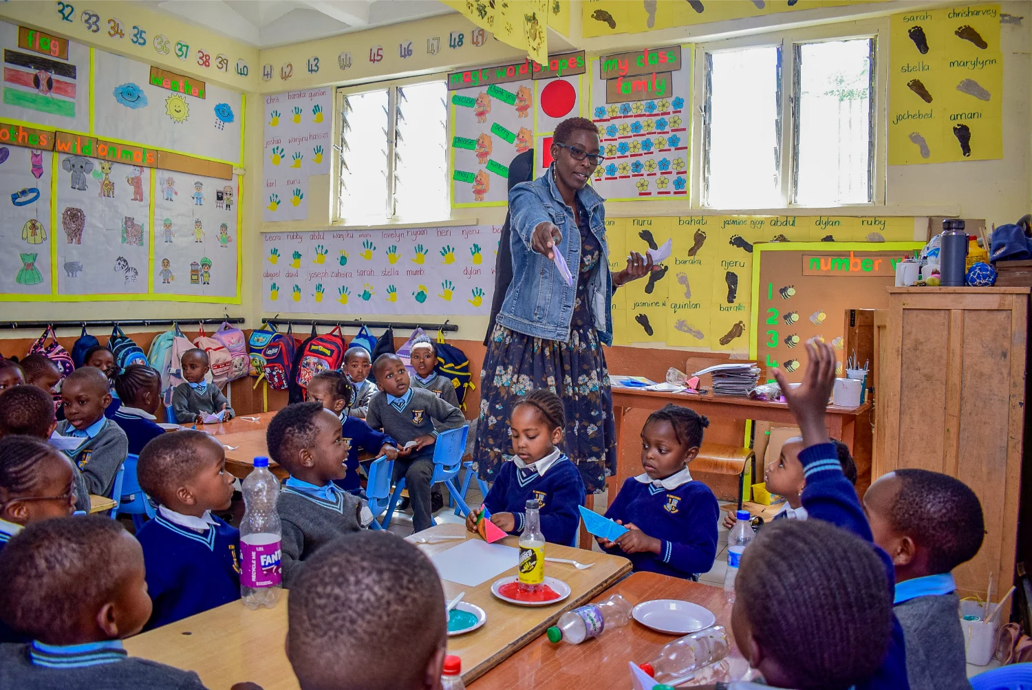 A Kindergarten teacher leading a hands-on lesson in a St. Christopher's classroom